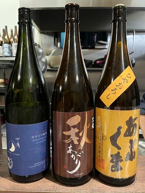 炭火と酒 心月 - 日本酒飲み比べ。『あぶくま』『黒龍秋あがり』お店の特選大吟醸『城陽×心月』。