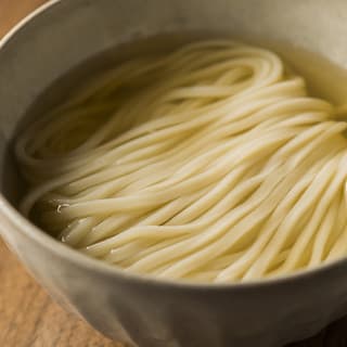 Handmade noodles and golden broth udon