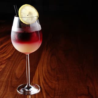 At the counter, one drink at a time.