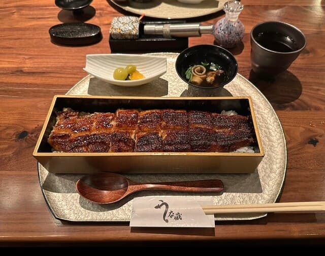 Inside the dazzlingly Asian-themed restaurant, enjoy grilled eel.